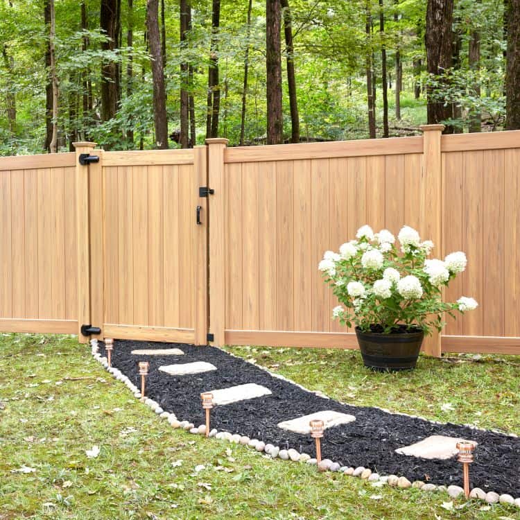 Wood fence near a garden path