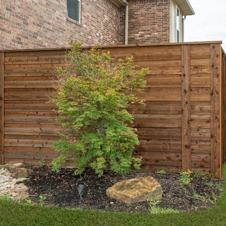 https://www.superiorfenceandrail.com/wp-content/uploads/2025/01/wood-fence-designs-dark-stained-wood-fence.jpg